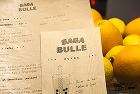 Menu des Zen Zoo (bubble Tea) de Baba Bulle, sur craft, avec agrumes en arrière plan